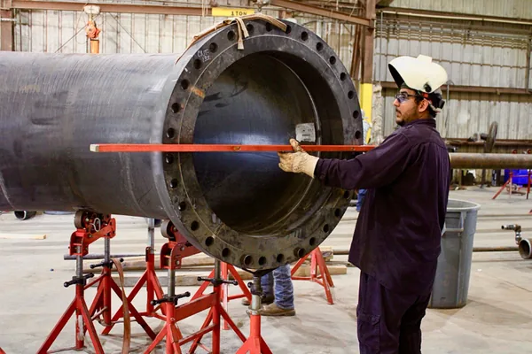 Inspector measuring a large flange